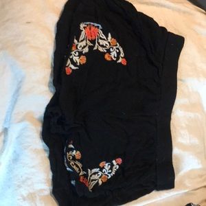 Black shorts with floral detail